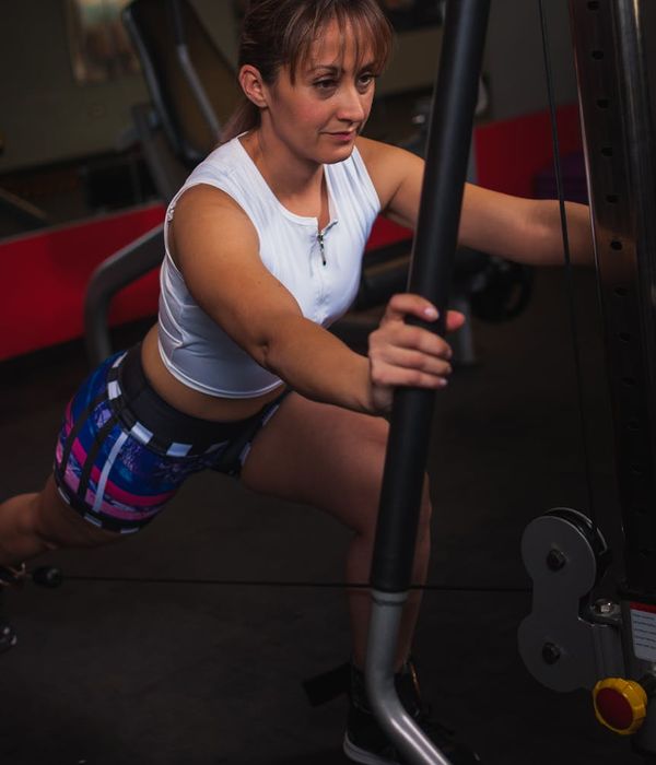 Active person performing gentle movement exercises indoors